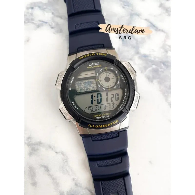 Reloj Casio Hombre Mod Ae-1000w Sumergible Malla Azul 2a Bisel Azul Fondo Negro
